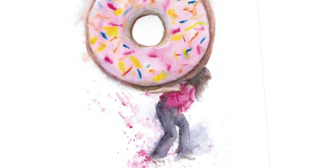 A woman carrying a giant donut