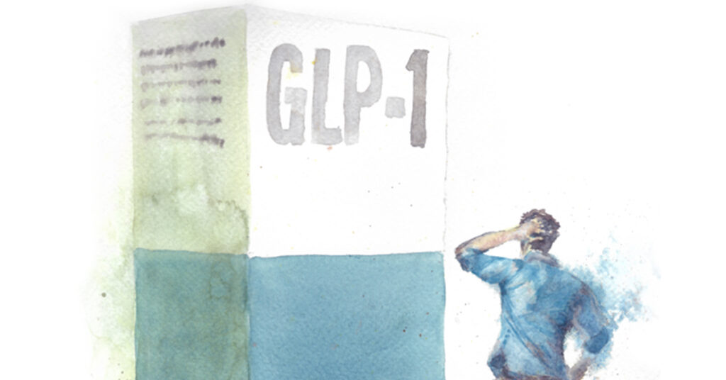 A giant GLP 1 box in front of a man